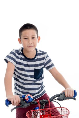 Asian schoolboy with backpack riding a bike isolated on white backgroundの写真素材