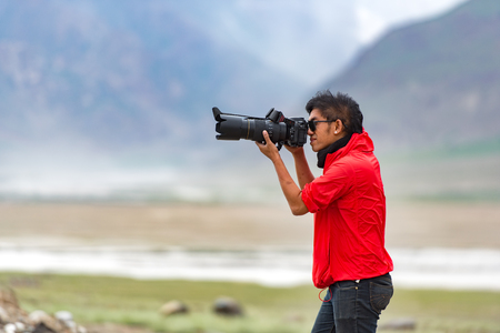 ZANSKAR, INDIA - JULY 15, 2015 : Untitled photographer taking photo from Himalayan Mountain, Zanskar, North Indiaのeditorial素材