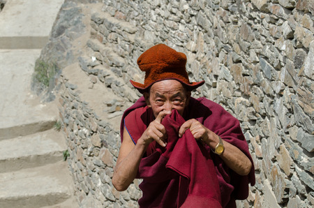 ZANSKAR, INDIA - JULY 15, 2015 : Untitled lama waiting for mystical mask dancing at Karsha Monastery (one of the oldest monastery), Zanskar, North Indiaのeditorial素材