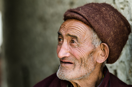 ZANSKAR, INDIA - JULY 15, 2015 : Untitled lama waiting for mystical mask dancing at Karsha Monastery...