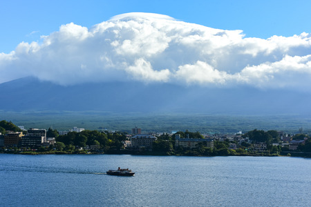 Landscape at kawaguchiko lake of Japan with big cloud covered Fuji Mountain.の写真素材