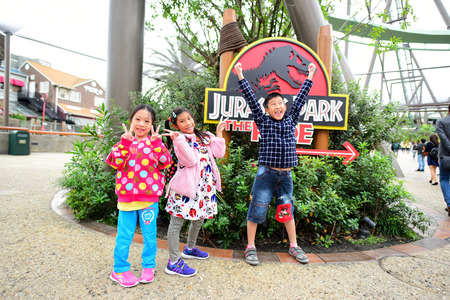 OSAKA, JAPAN - OCTOBER 13, 2016: Happy children at Jurassic Park The Ride at Universal Studios Japanのeditorial素材