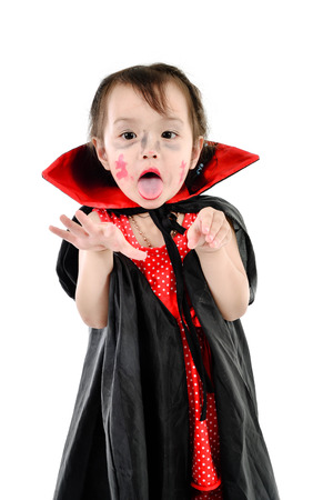 Asian girl with halloween costume on white.の写真素材