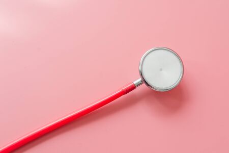 Stethoscope on pink background with copy spaceの写真素材