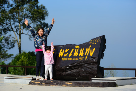 PHETCHABURI, THAILAND - DECEMBER 26, 2015: Tourists family on Panoen Thung Scenic point. Altitude 974 metres. Kaeng Krachan National Park, Phetchaburi. Thailand.のeditorial素材
