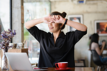 Beautiful Asian woman massage hersel to protect an office syndrome, work, health lifestyle concept.の写真素材