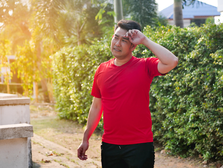 Tried man after finished exercise outdoor.の写真素材