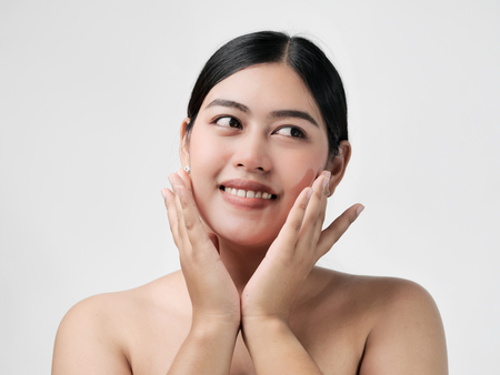 Beautiful Young asian Woman with Clean Fresh Skin look. Girl beauty face care. Facial treatment. Cosmetology, beauty and spaの写真素材