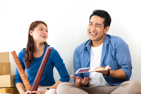 Asian couple choosing colour palette for their new house, lifestyle concept.の写真素材