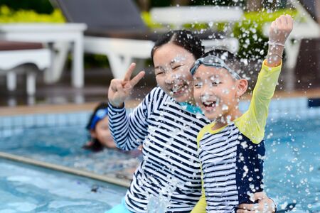 Happy Asian family enjoying in pool at PRACHUBKIRIKHAN, THAILAND - FEBRUARY 06, 2019のeditorial素材