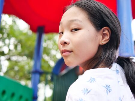 Asian girl playing at playground, lifestyle concept.