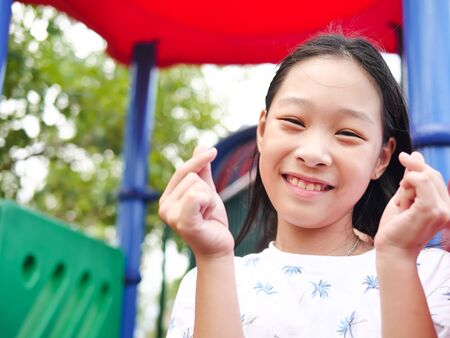 Asian girl playing at playground, lifestyle concept.の写真素材