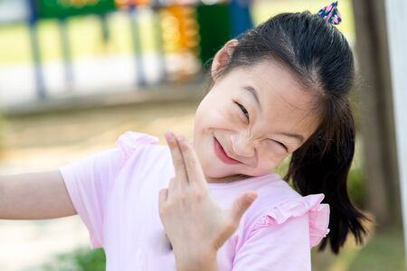 Happy Asian girl at playground outdoor.の写真素材