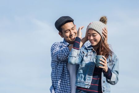 Asian couple enjoying nature view outdoor, lifestyle concept.の写真素材