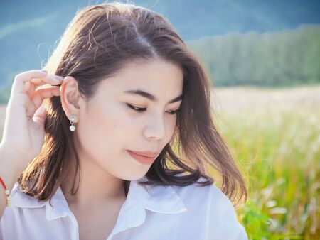 Asian woman relaxing at nature outdoor, lifestyle concept.の写真素材