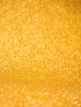 Abstract gold glitter bokeh lights. defocused lights background.の写真素材