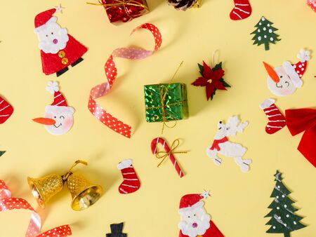 Christmas objects on yellow background.の写真素材