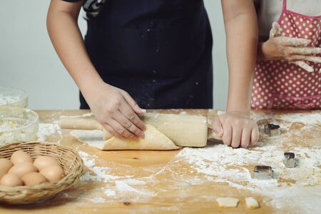 Kid hands preparing dough for pizza or bread, lifestyle concept, motionの写真素材