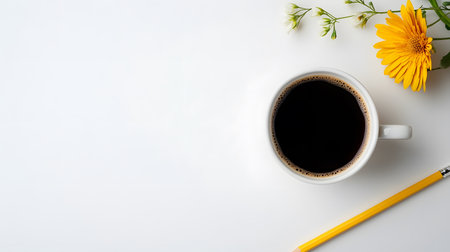 Coffee cup and yellow flower on white background with copy space.の素材