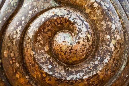 The gold leaf on Buddha statue in temple of Thailandの写真素材