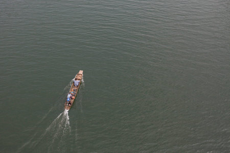 The traditional thai long-tail boat moving on the lakeの写真素材