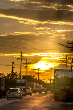 Mueang, Songkhla, Thailand ,2015-08-14 : Sunset through the streets in the industrial zone.のeditorial素材
