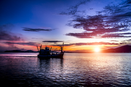 Sunset lake water and fish fishing out Gideの写真素材