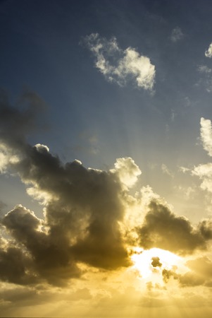 Between the clouds and the sun natural coming together.の写真素材