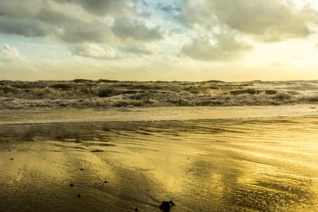 Golden light of sunrise Samila beach turns into a beautiful golden colorの写真素材