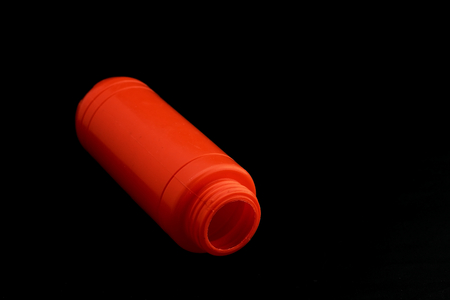 Plastic bottle containing orange chili sauceの写真素材