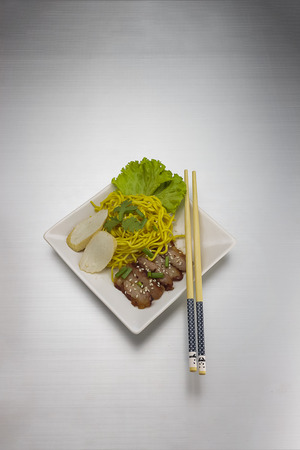 Dry yellow noodle thai food on Aluminum bronze