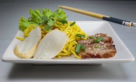 Dry yellow noodle thai food on Aluminum bronzeの写真素材