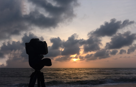 silhouette camera background sunset