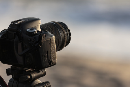Camera on a tripod to take pictures of the sea.