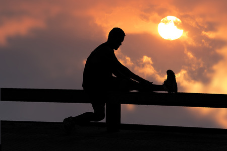 silhouette, one man, natural exercise, sunrise and sunset.の写真素材
