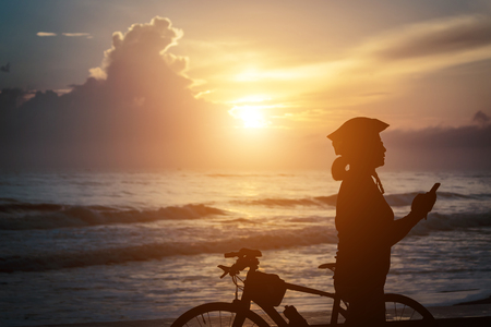 Women stop tired. After cycling and watching the view at Athat Songkhla.の写真素材