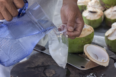 Coconut water, natural drink Refreshing. Can be eaten. White coconut meat and water simultaneously add more delicious.の写真素材