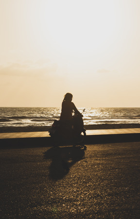 silhouette motorcycle in the morningの写真素材