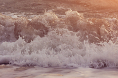 The beauty of the sea and the waves reflecting from the sunの写真素材