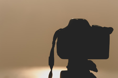 silhouette, camera and nature by the sea.