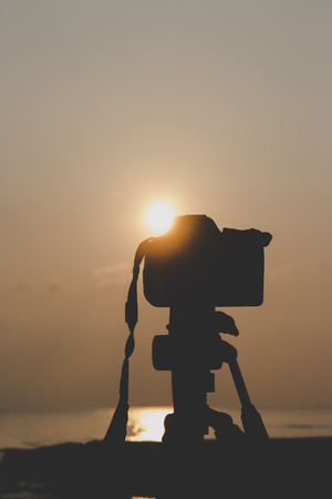 silhouette, camera and nature by the sea.の写真素材
