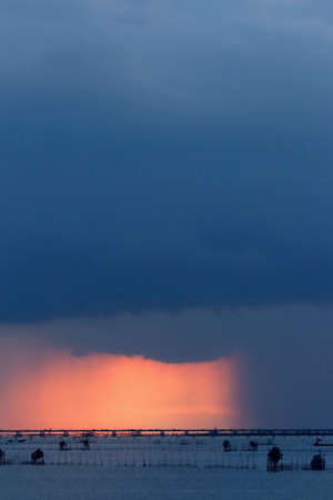 heavy rain clouds dark but there is also the light of the sun shining