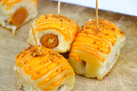 Mini sausage and cheese rolls, sold at roadside shops in Thailandの写真素材