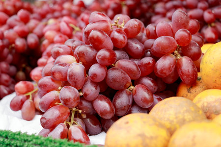 Set of pictures of red grapes sold at roadside fruit shops.の写真素材