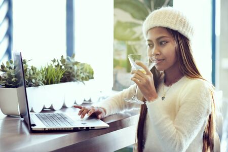 Beautiful asian girl blogger in a cafeの写真素材