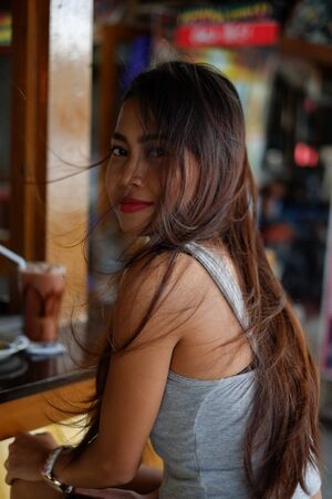 Beautiful asian girl in a restobarの写真素材