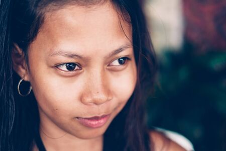 Natural portrait of beautiful young native asian woman smilingの写真素材