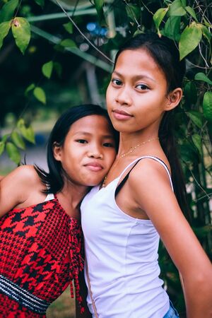 Native Asian people, sisters portrait in the farmの写真素材