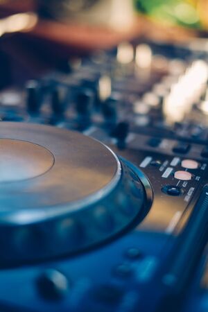 professional mixing controller at the beach ** Note: Shallow depth of field