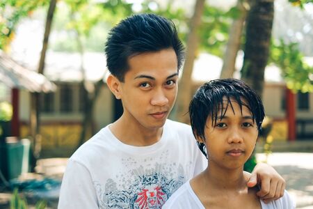 Young Asian couple on summertime vacationの写真素材